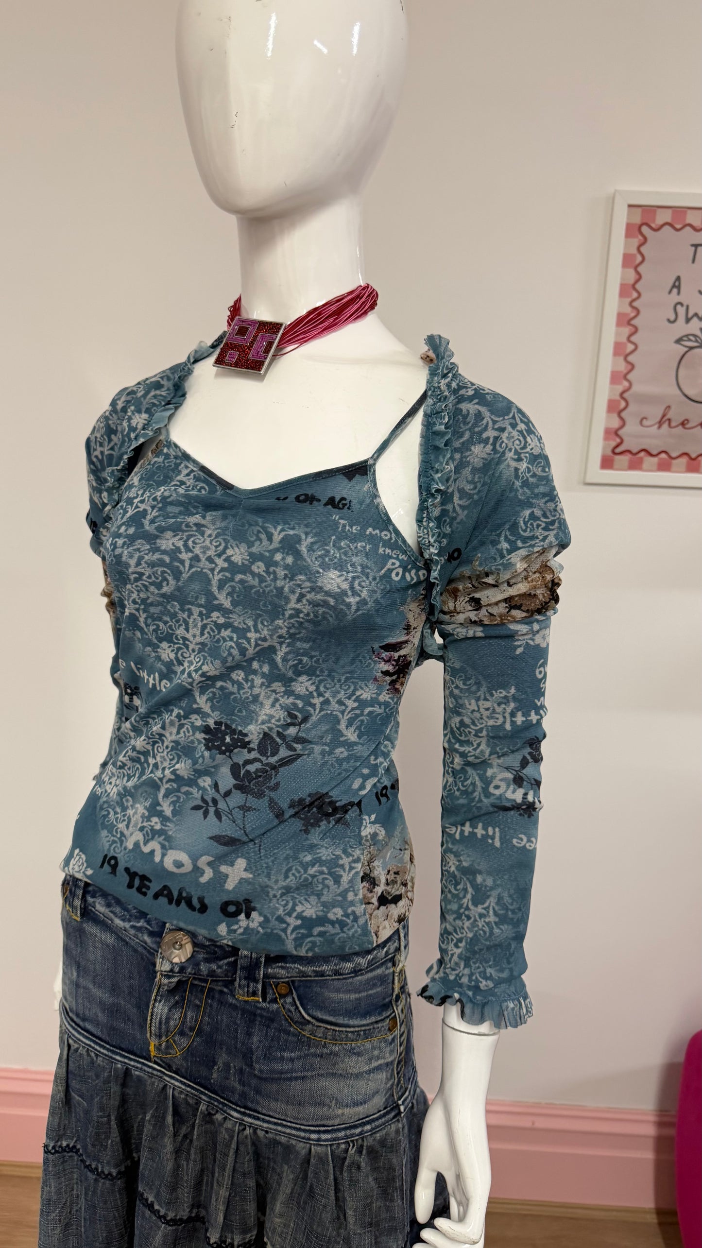125 blue meshed top with sleeves attached