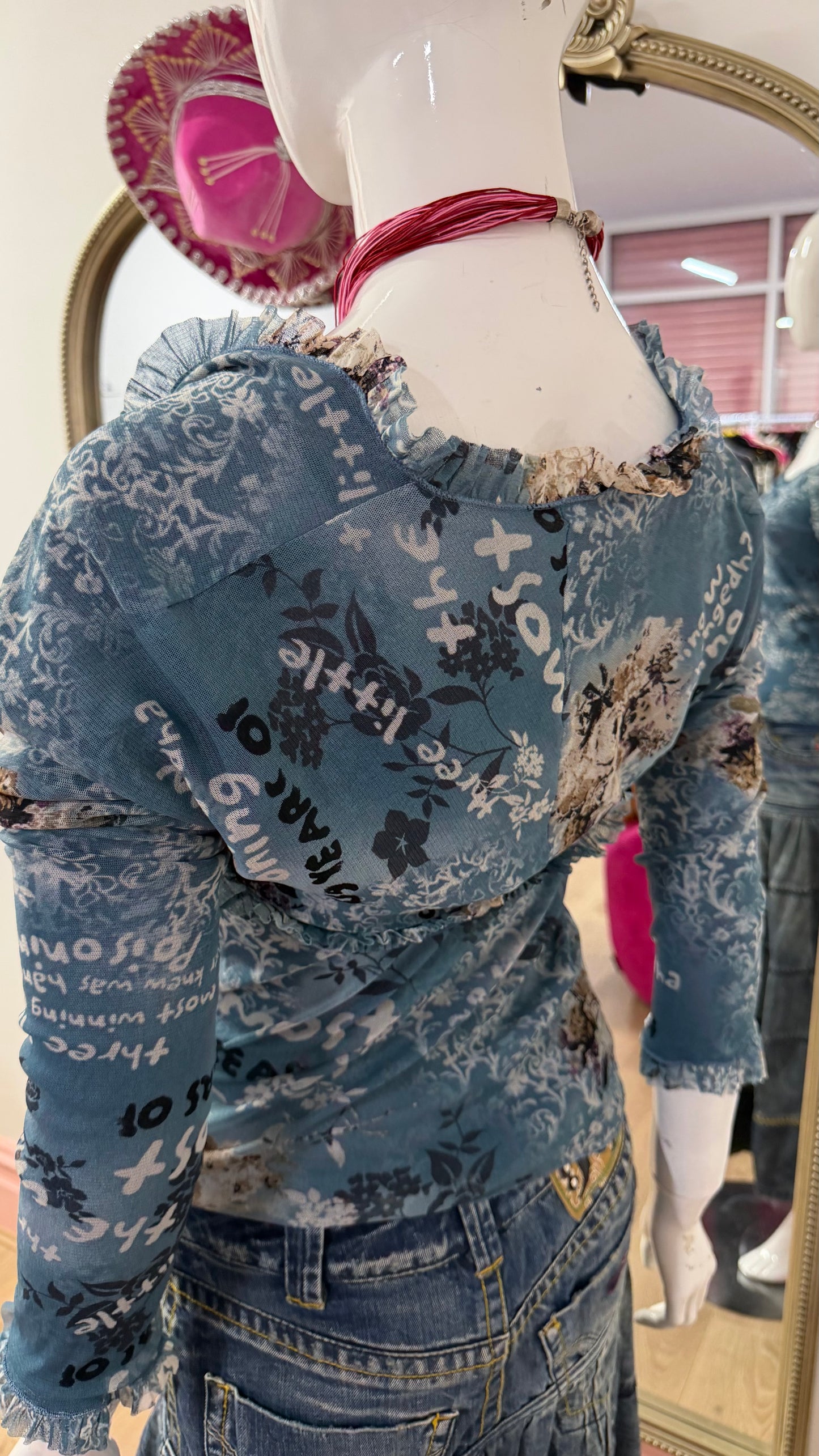 125 blue meshed top with sleeves attached