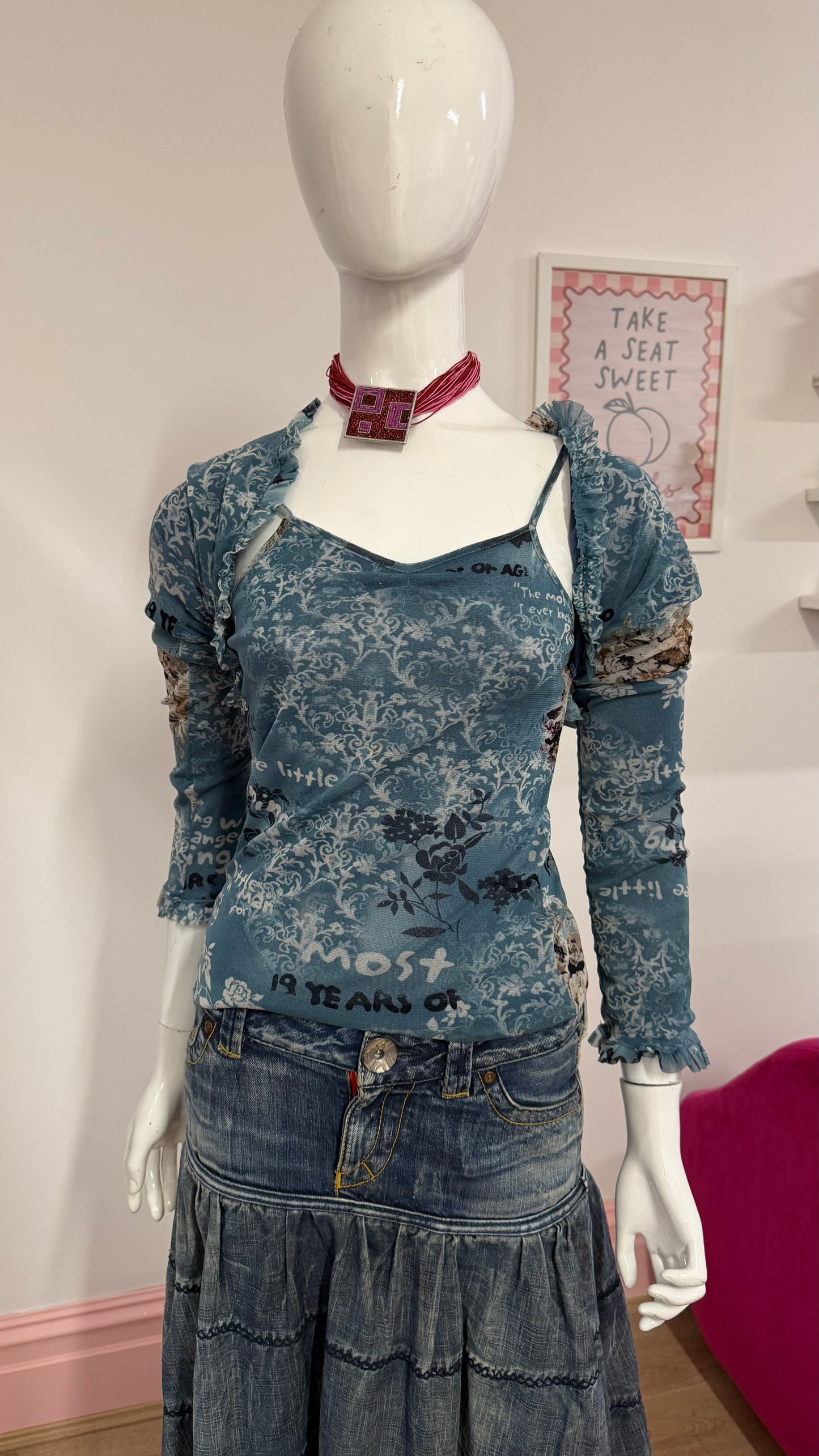 125 blue meshed top with sleeves attached